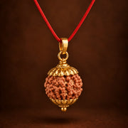 6 Mukhi Rudraksha pendant with golden-finish caps and red thread - photo 1
